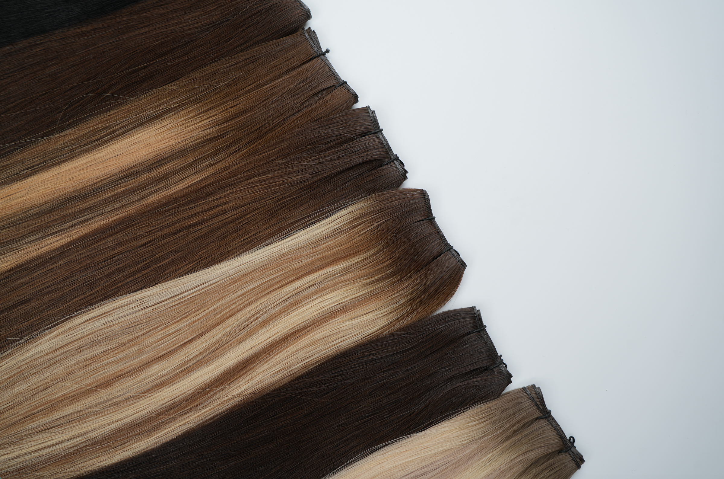 genius wefts for professional hair stylists. Highest quality and luxury extensions with no return hair. 